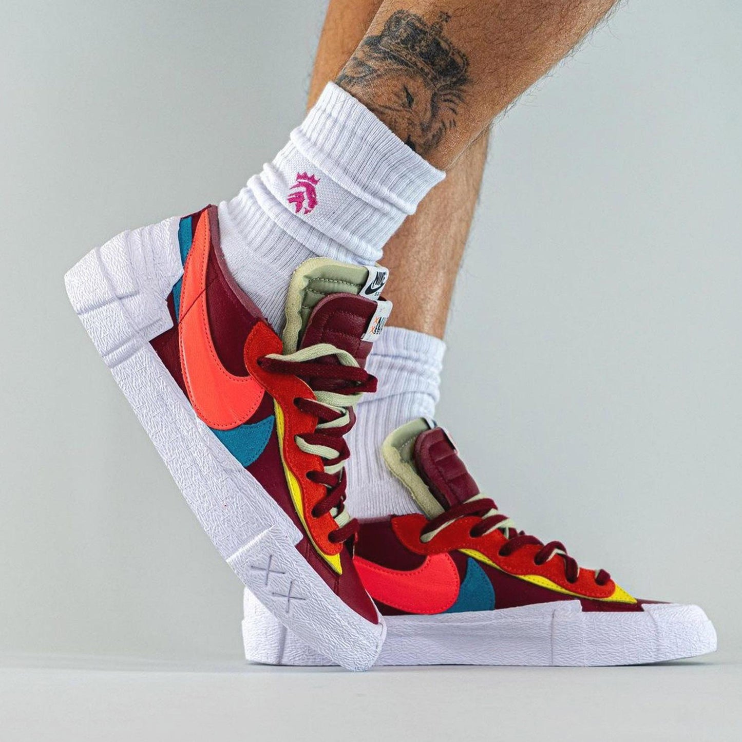 KAWS x sacai x Nike Blazer Low ‘Team Red’ - Kick Game
