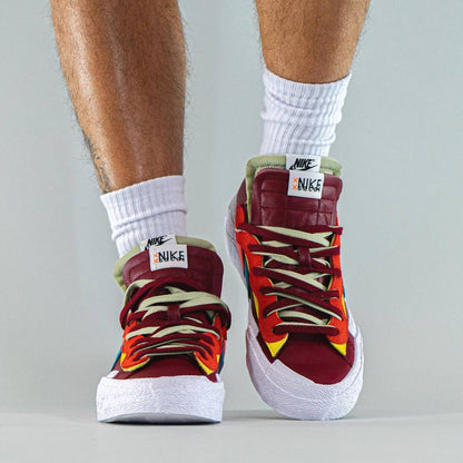 KAWS x sacai x Nike Blazer Low ‘Team Red’ - Kick Game