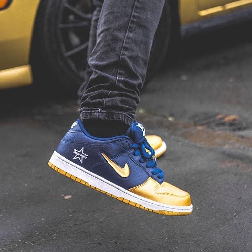 Supreme x Nike Dunk SB Low QS 'Metallic Gold' - Kick Game